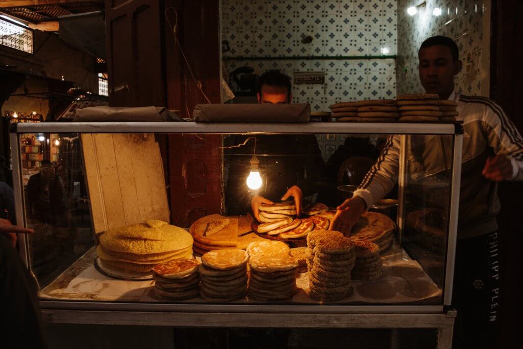 Men selling fresh bread in Fes, Morocco